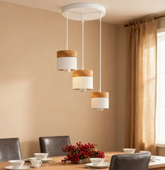 Lampadario cilindrico con base in legno dal design nordico per la sala da pranzo