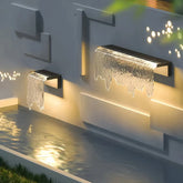 Applique da parete di design LED da esterno solare con effetto cascata per giardino