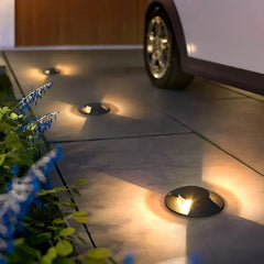 Segnapasso calpestabile esterno LED rotondo nero moderno con effetto luminoso