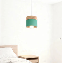 Lampadario cilindrico con base in legno dal design nordico per la sala da pranzo
