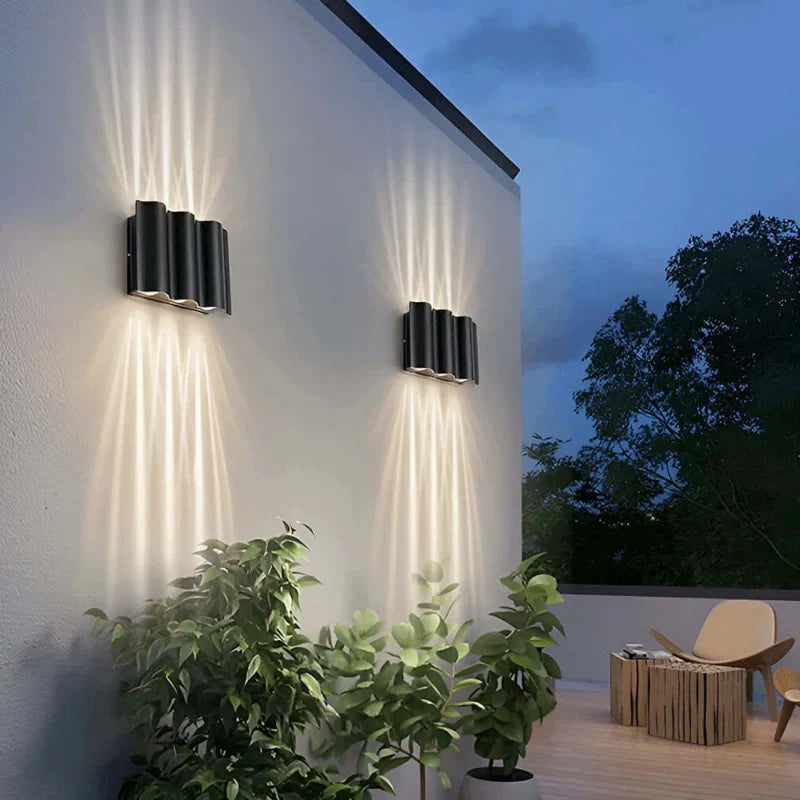 Applique da esterno up down moderno LED in metallo nero con profilo ondulato