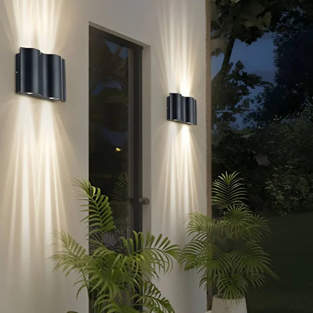Applique da esterno up down moderno LED in metallo nero con profilo ondulato