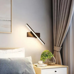 Applique LED lineare orientabile in metallo dal design minimalista per camera da letto