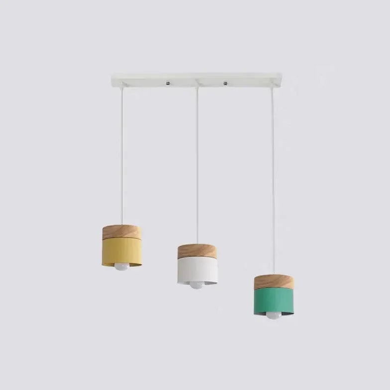Lampadario cilindrico con base in legno dal design nordico per la sala da pranzo