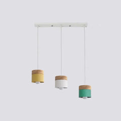 Lampadario cilindrico con base in legno dal design nordico per la sala da pranzo