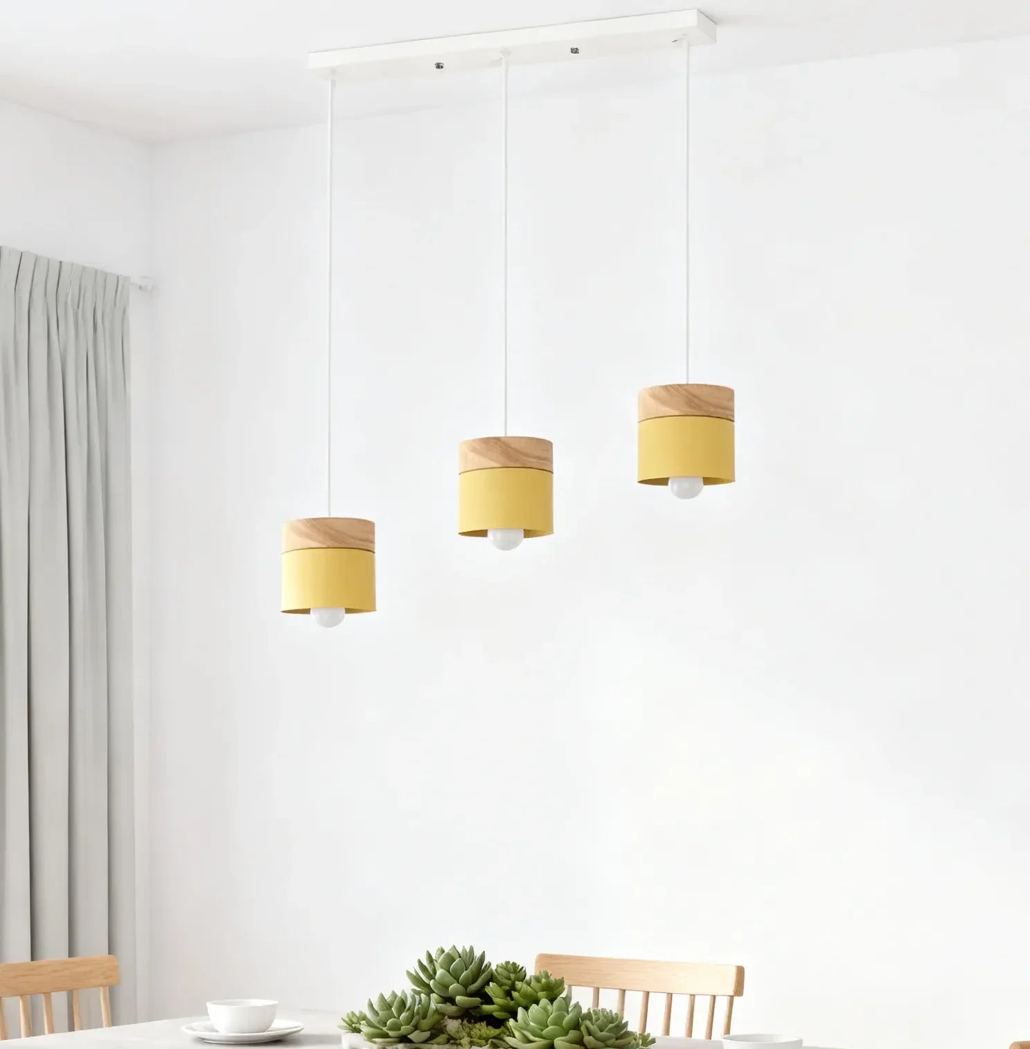 Lampadario cilindrico con base in legno dal design nordico per la sala da pranzo