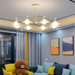 Lampadario moderno a bracci oro con sfere da soggiorno