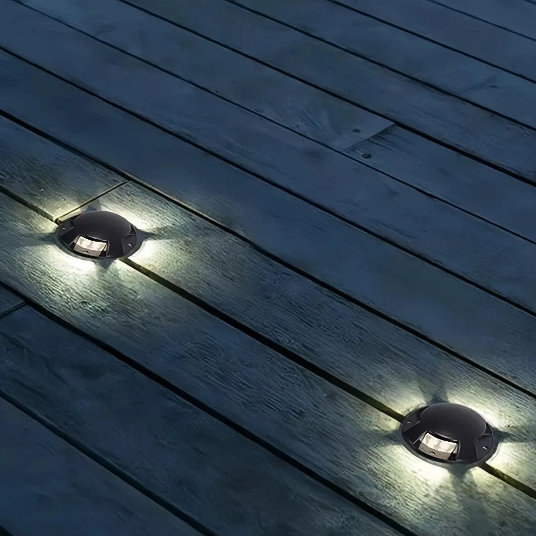 Segnapasso calpestabile esterno LED rotondo nero moderno con effetto luminoso