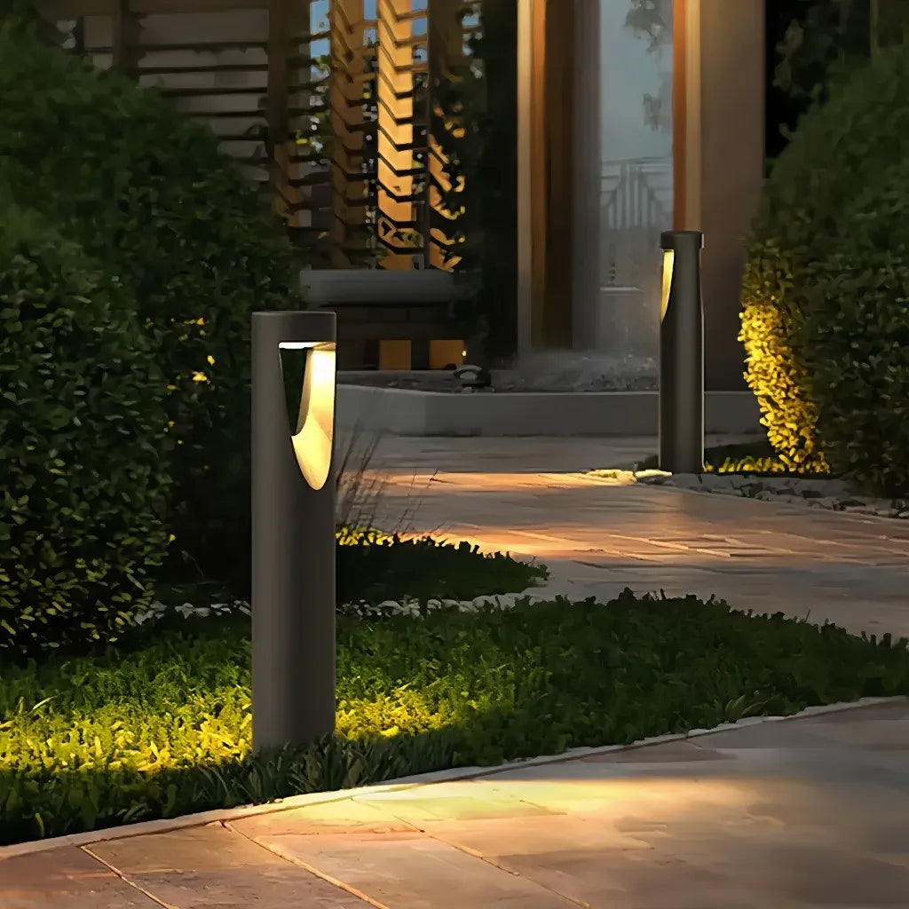 Paletto LED da giardino cilindrico in metallo nero dal design moderno