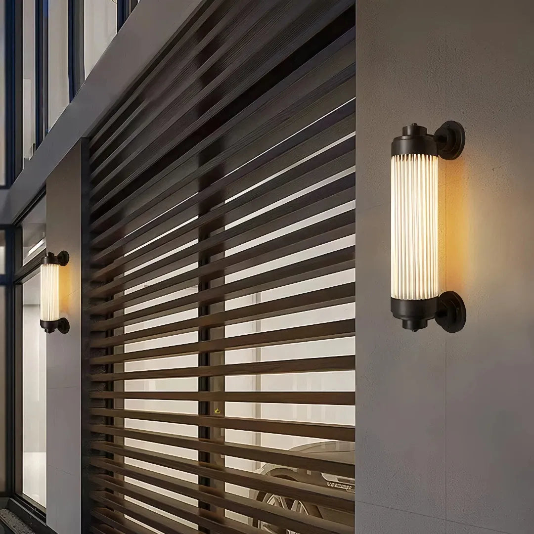 Applique per esterno a LED moderna cilindrica nera con vetro scanalato