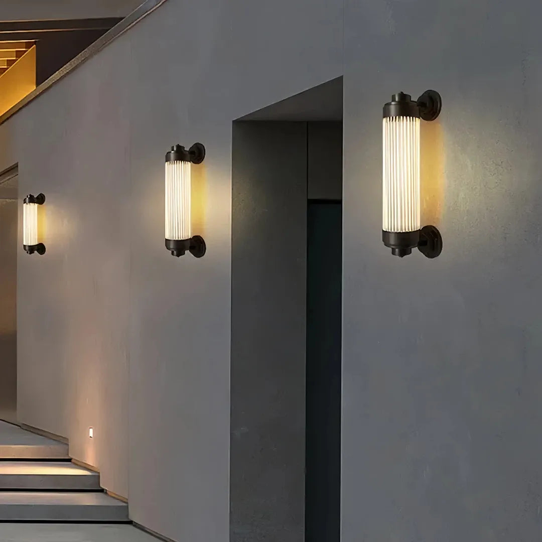 Applique per esterno a LED moderna cilindrica nera con vetro scanalato