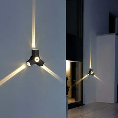 Applique LED da parete per esterno dal design moderno con fasci luminosi