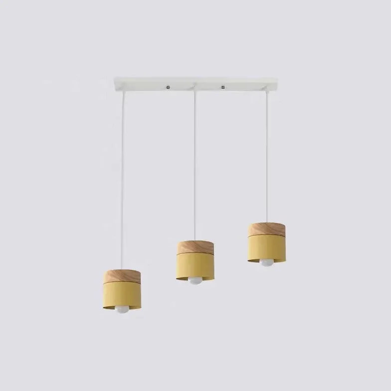 Lampadario cilindrico con base in legno dal design nordico per la sala da pranzo