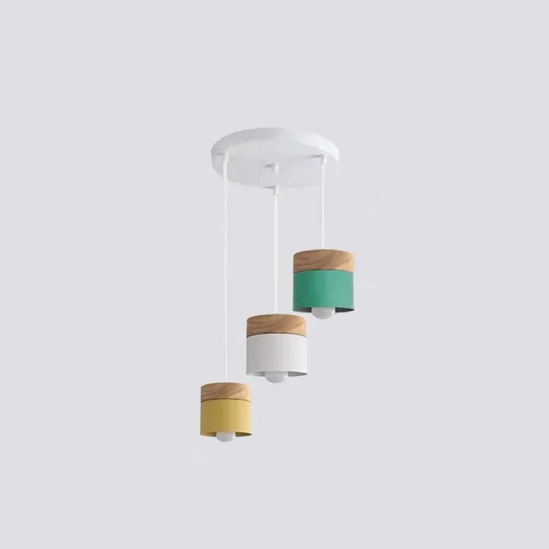 Lampadario cilindrico con base in legno dal design nordico per la sala da pranzo