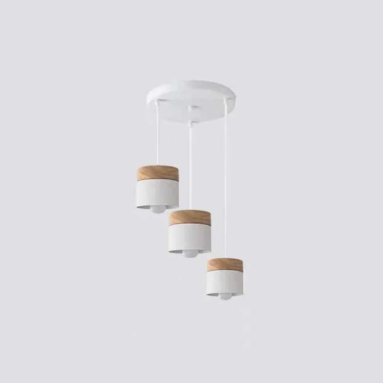 Lampadario cilindrico con base in legno dal design nordico per la sala da pranzo