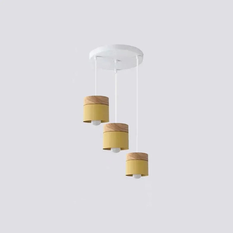 Lampadario cilindrico con base in legno dal design nordico per la sala da pranzo