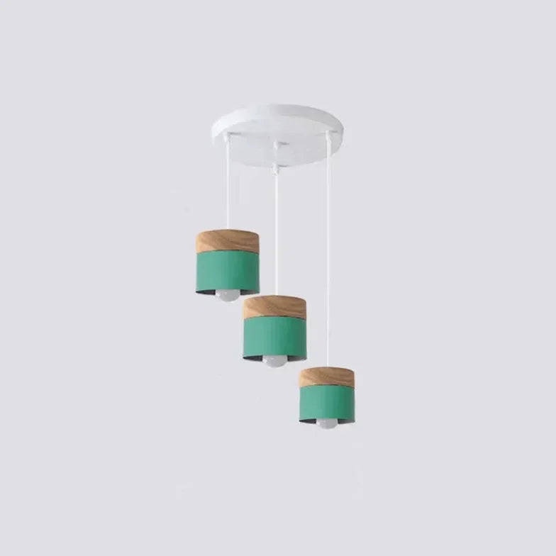 Lampadario cilindrico con base in legno dal design nordico per la sala da pranzo