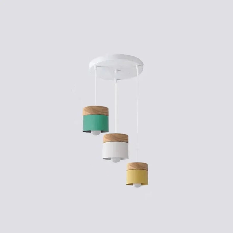 Lampadario cilindrico con base in legno dal design nordico per la sala da pranzo